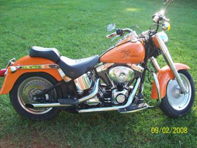 Orange 2001 Harley Davidson Fatboy Motorcycle (this photo is for example only; please contact seller for pics of the actual motorcycle for sale in this classified)