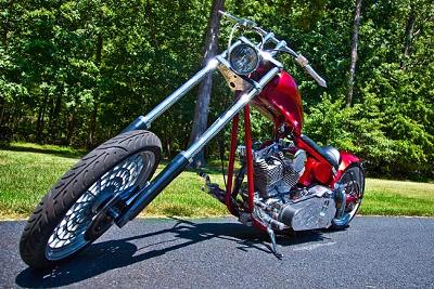 2005 CUSTOM CAROLINA CHOPPER Candy Apple Red and Black House of Kolor Paint 280 rear tire with single swing arm, a 113 MidWest El Bruto engine, a 5 speed Indian transmission, Walz Hardcore 1 of a kind custom rims, 14 over wide glide front end