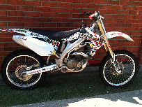 not too good of a pic of the 2005 Honda CRF450r but call for questions