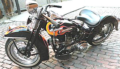 ALL original 1949 Harley Flathead 45 black with a custom motorcycle paint job.