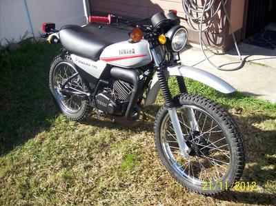 The 1979 Yamaha DT175 MX dirt bike runs fast, has New grips and levers and is great for camping