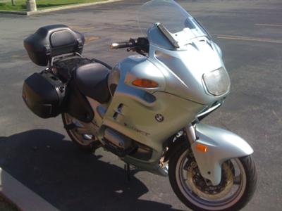Silver 1998 BMW RT1100 motorcycle with side and top cases