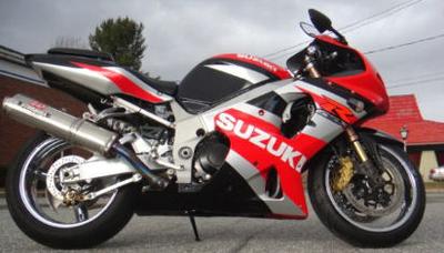 2002 Suzuki GSXR1000 GSX-R  with Red, Black and Silver paint color option, chrome wheels front and rear, a FULL Yoshimura exhaust system, a Sportech chrome windshield, custom color-matched paint on the undertail and fender eliminator, a vertical license plate holder and chrome handgrips