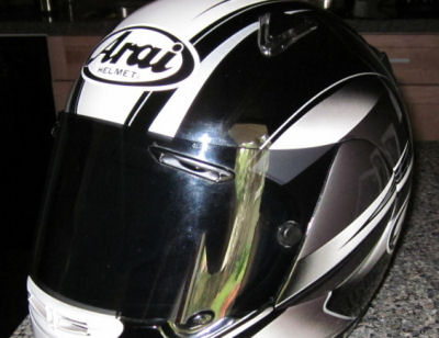 black and white and gray Arai Astral X Size L Large LG Motorcycle Racing Helmet with a Tinted Shield