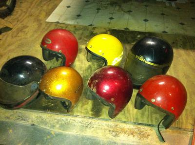 assortment of motorcycle helmets