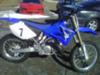 Blue and White 2009 Yamaha YZ 250 2 Stroke Dirt Bike w Renthal fatbars (this motorcycle is for example only; please contact seller for pics of the actual bike for sale)