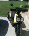 Yellow and Black 2009 Yamaha Zuma 125 (this photo is for example only; please contact seller for pics of the actual motor scooter for sale in this classified)