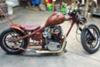 This custom chopper has a homemade frame, a hand made 60's style peanut fuel tank, a 6 sided stock sissy bar that is hand made and molded through the fender and on to the bike's frame