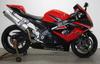 2006 GSXR 1000 with red and black paint color option, frame sliders tinted windscreen,a rear fender eliminator and a Hindle high-mount exhaust system