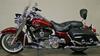 2010 Harley Davidson Road King FLHR Touring motorcycle with Red Hot Sunglo paint color