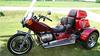 Custom VW trike motorcycle w Jewel Red paint 1600CC VW motor, a 4 SPEED transmission with reverse, disc brakes, SS steel running boards, an electronic ignition, a trailer hitch and side suitcases (this photo is for example only; please contact seller for pics of the actual motorcycle for sale in this classified)
