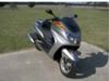 Silver Yamaha scooter  (this photo is for example only; please contact seller for pics of the actual motor scooter for sale in this classified)